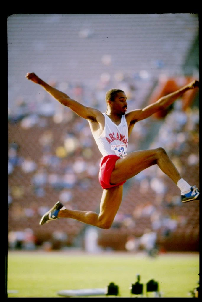1984: Mike Conley sails through the air in a triple jump event during the United States Olympic Trials. Mandatory Credit: Tony Duffy /Allsport