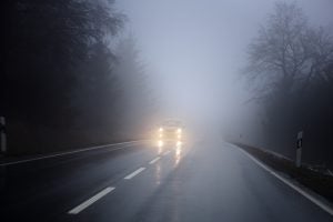 Fog on the country road, oncoming traffic - bad weather conditions, shot during driving - cam was fixed on a tripod. Some minor bluring